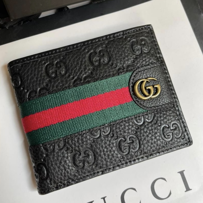 6ce3748a-6f9b-4949-a49f-1e39a9f06e82 Gucci Iconic Reverse GG Embossed Wallet