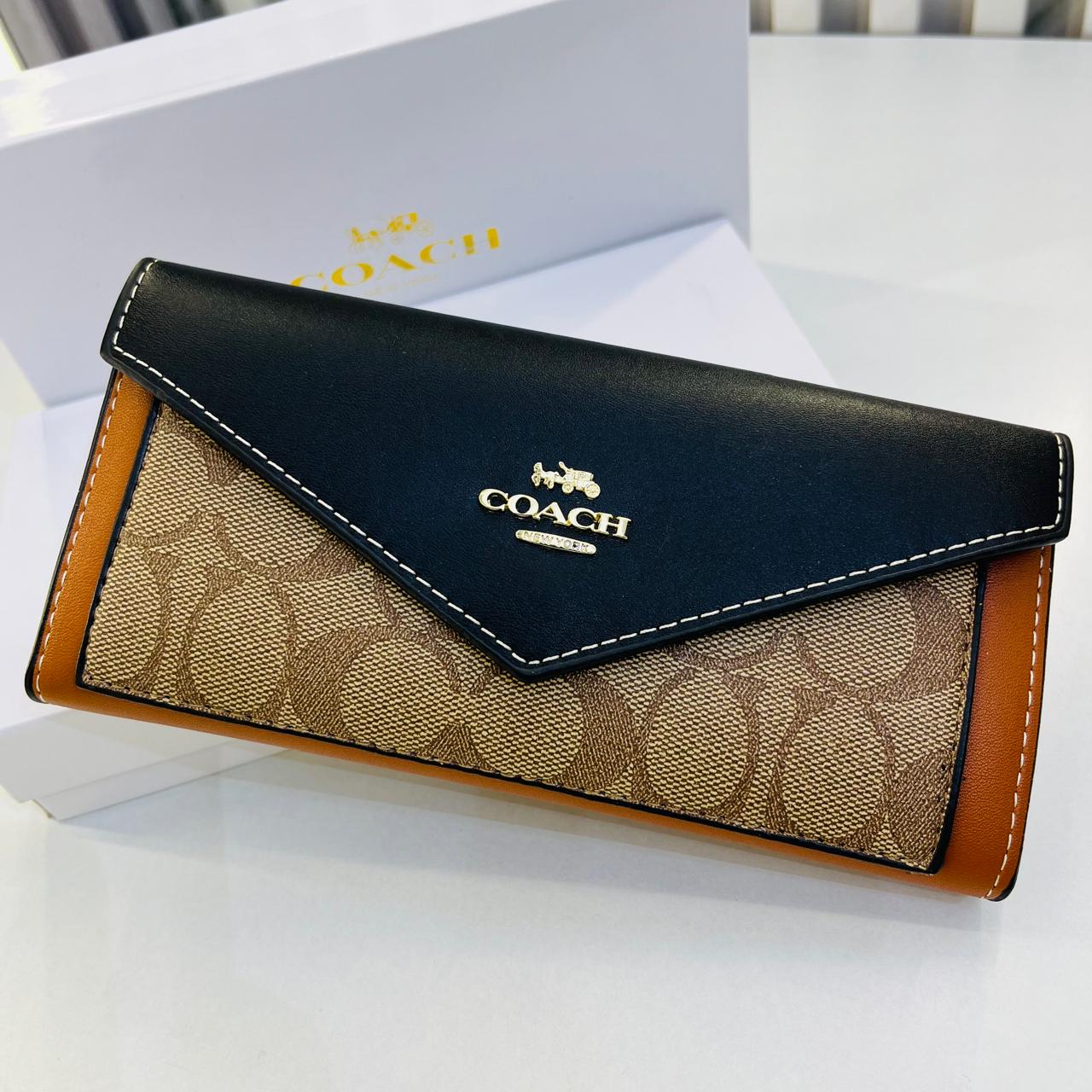 WhatsApp Image 2024-06-07 at 7.29.05 PM (1) Coach Black Brown Three Fold Women’s Wallet
