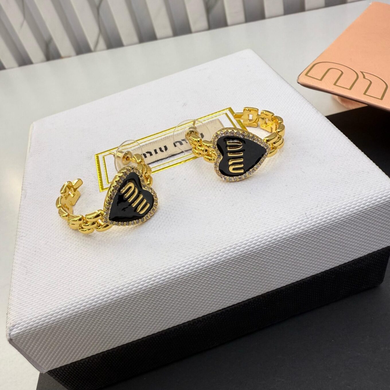 WhatsApp Image 2025-04-01 at 3.23.42 PM Miu Miu Golden Black Earring