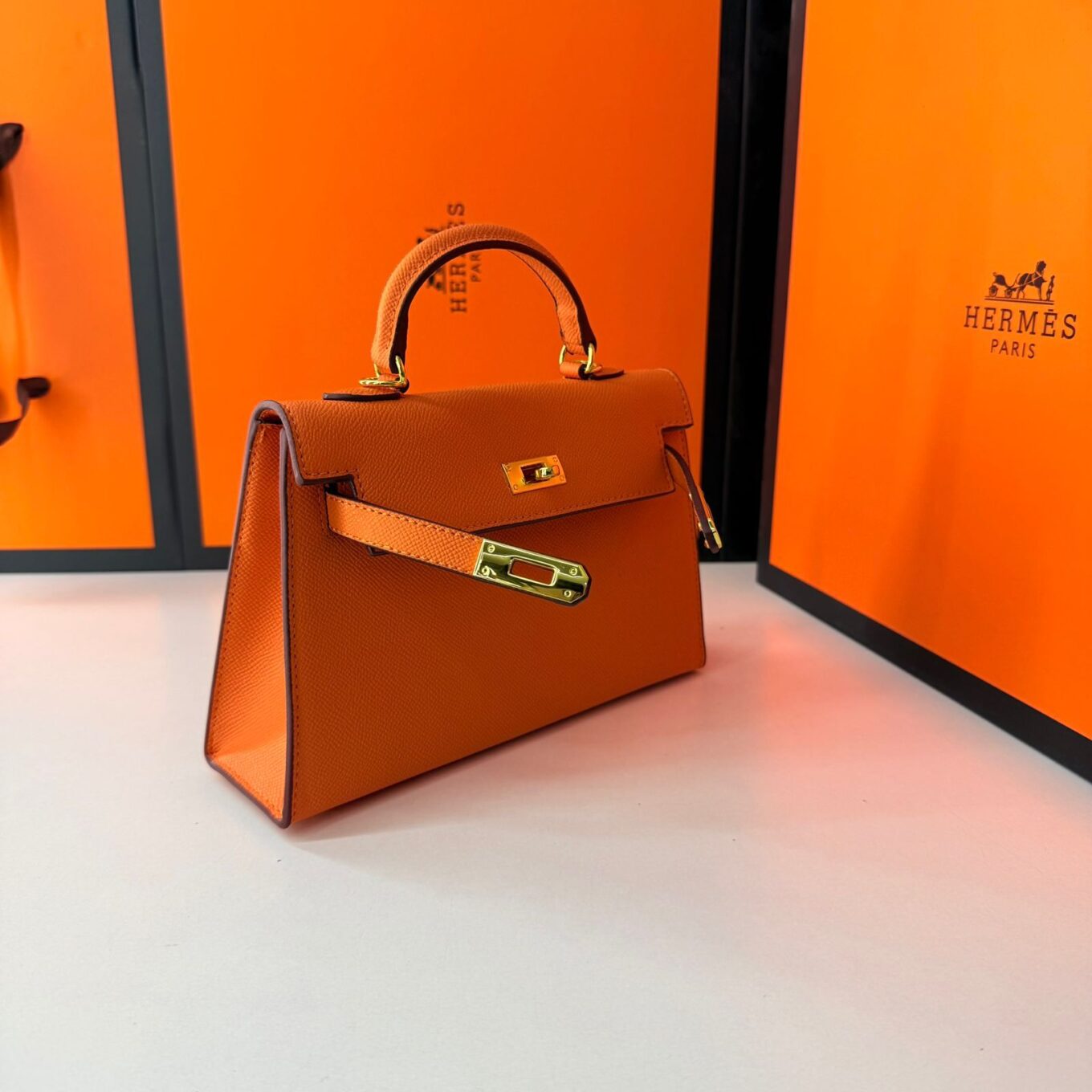 WhatsApp Image 2025-08-26 at 11.51.17 AM (1) Hermes Kelly Mini Orange Handbag