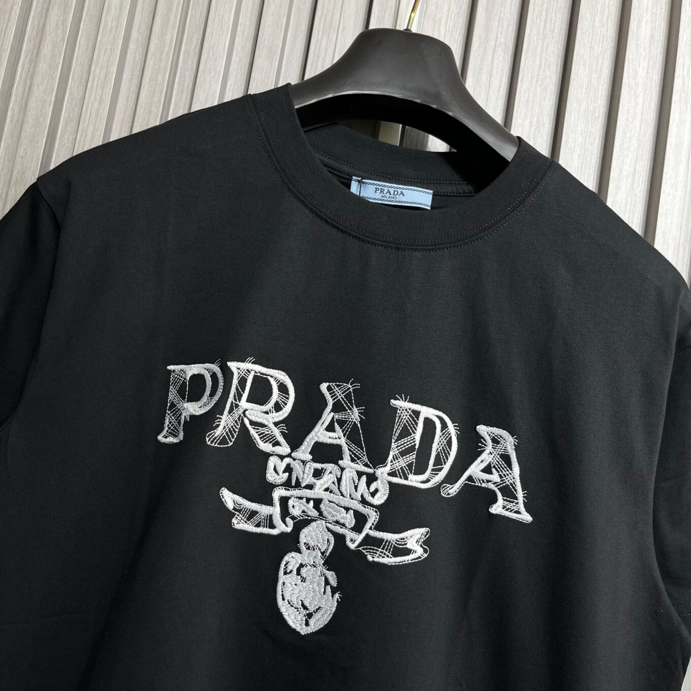 WhatsApp Image 2025-09-11 at 5.02.35 PM (1) Prada Embroidered Logo Black Tshirt For Men